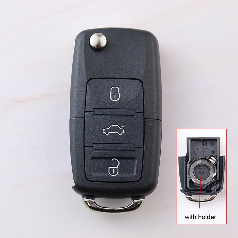 Car key fob with inset showing key blade and holder on a white background