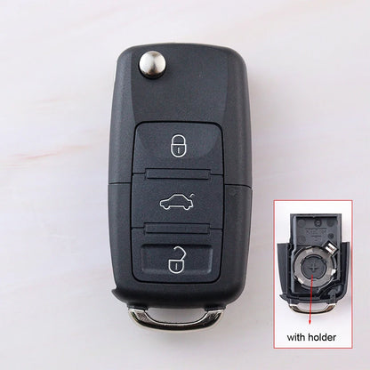 Car key fob with inset showing key blade and holder on a white background