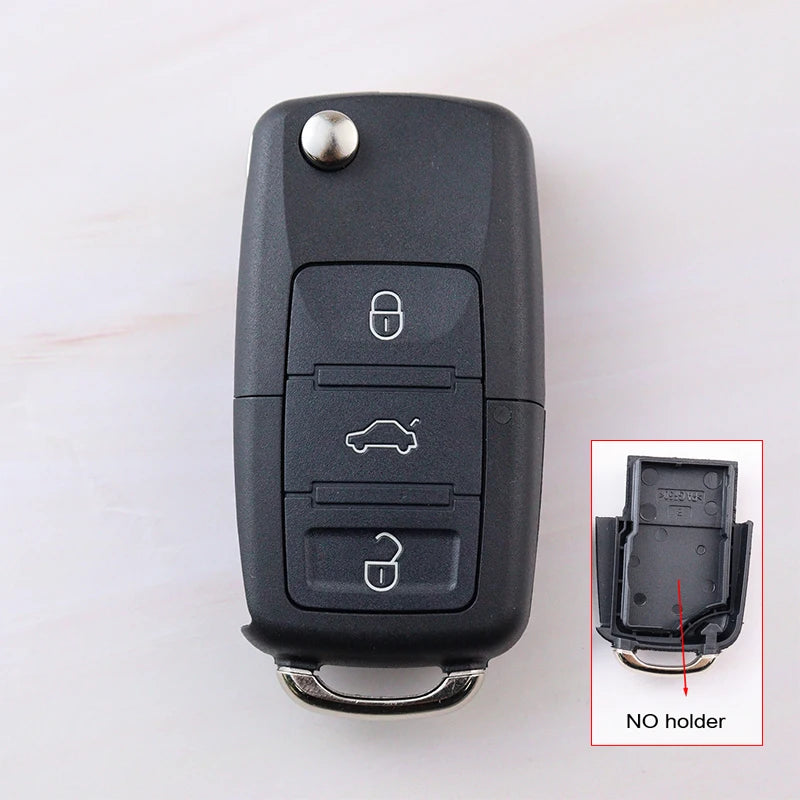 Car key fob with three buttons on a white background, inset showing key fob without holder.