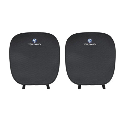 Two black car seat covers with Volkswagen logo on a white background