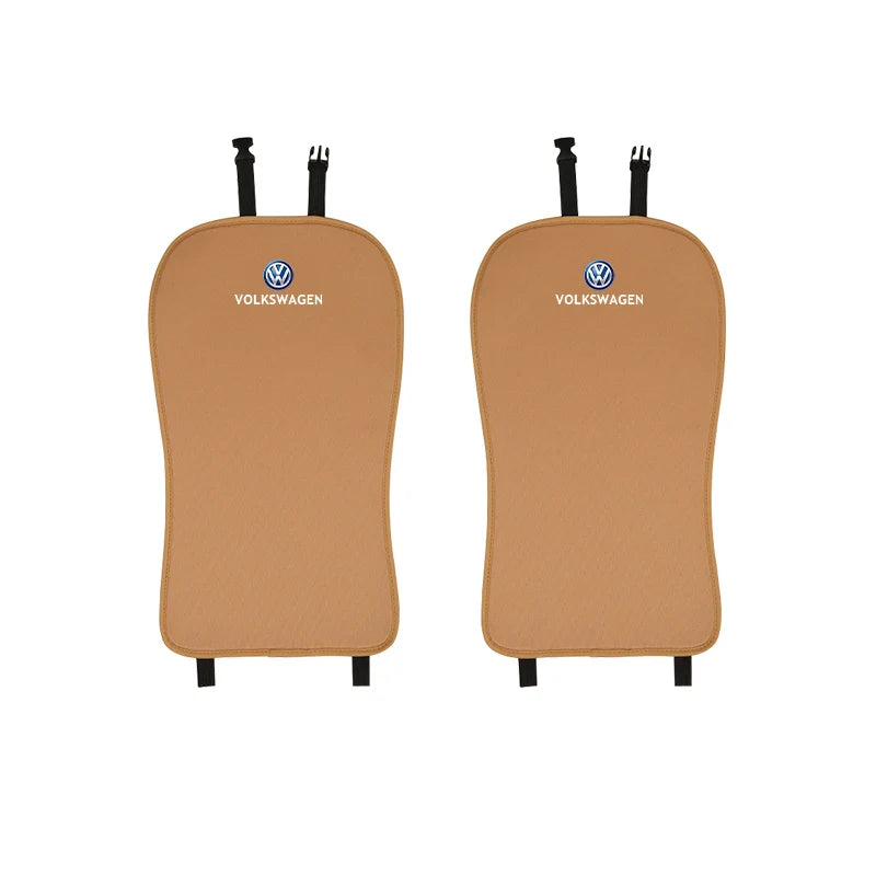 Two brown Volkswagen car seat covers on a white background