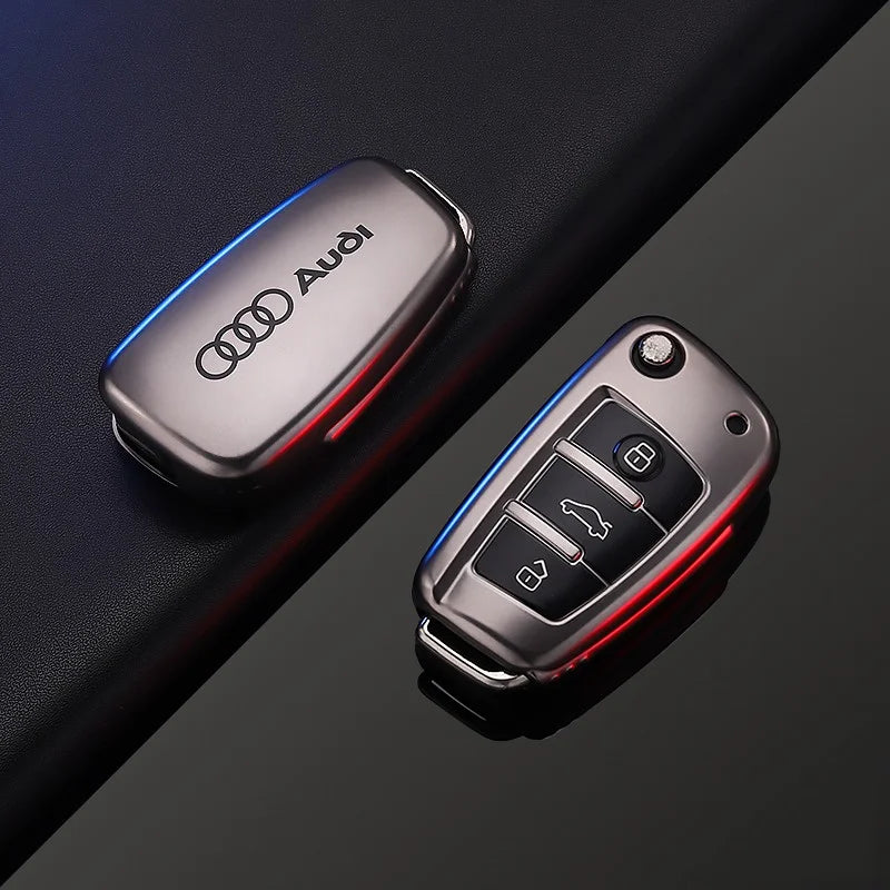 Audi car key fob cover and key fob on a dark background
