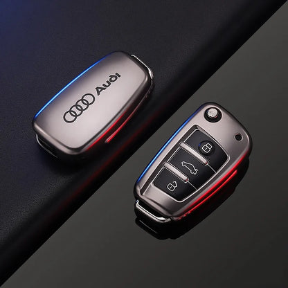 Audi car key fob cover and key fob on a dark background