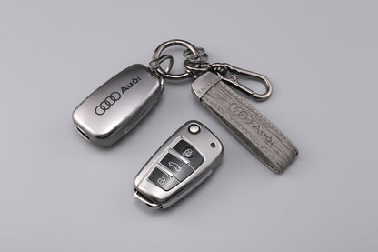 Audi car key fob cover and keychain on a dark surface