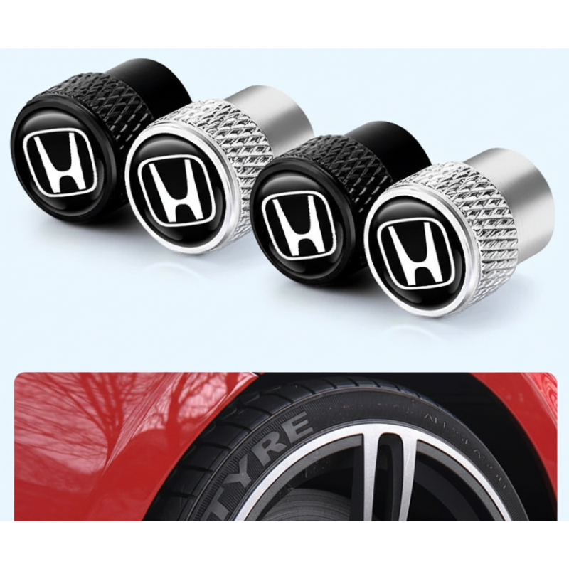 Four Honda logo tire valve caps with a close-up of a red car tire.