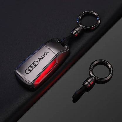 Audi key fob cover with keychain on a dark background