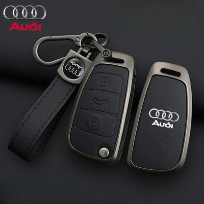 Audi key fob with leather strap on a dark background