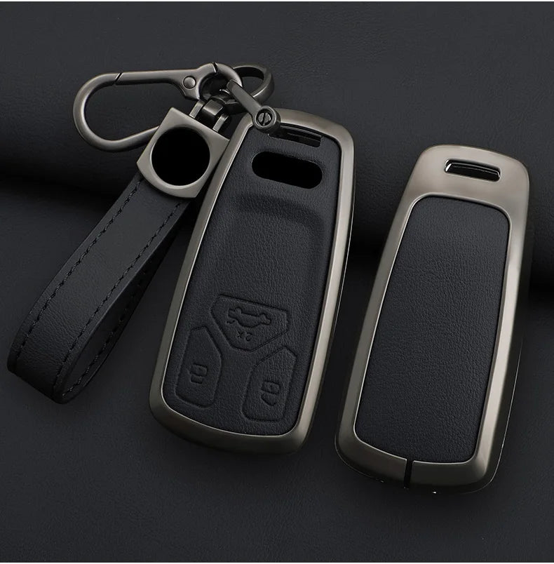 Black car key fob cover with keychain on a dark background