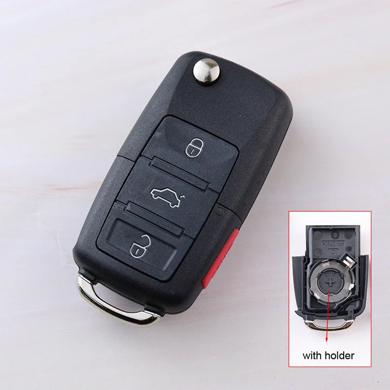Car key fob with three buttons on a white background, inset showing the key fob with holder.