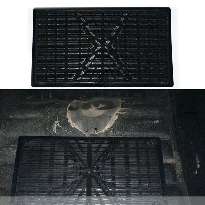 Black rubber mat with tread pattern on a white background