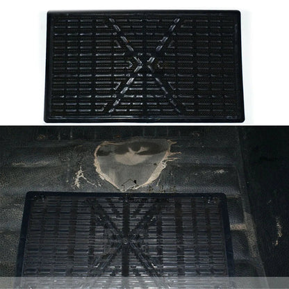 Black rubber mat with tread pattern on a white background
