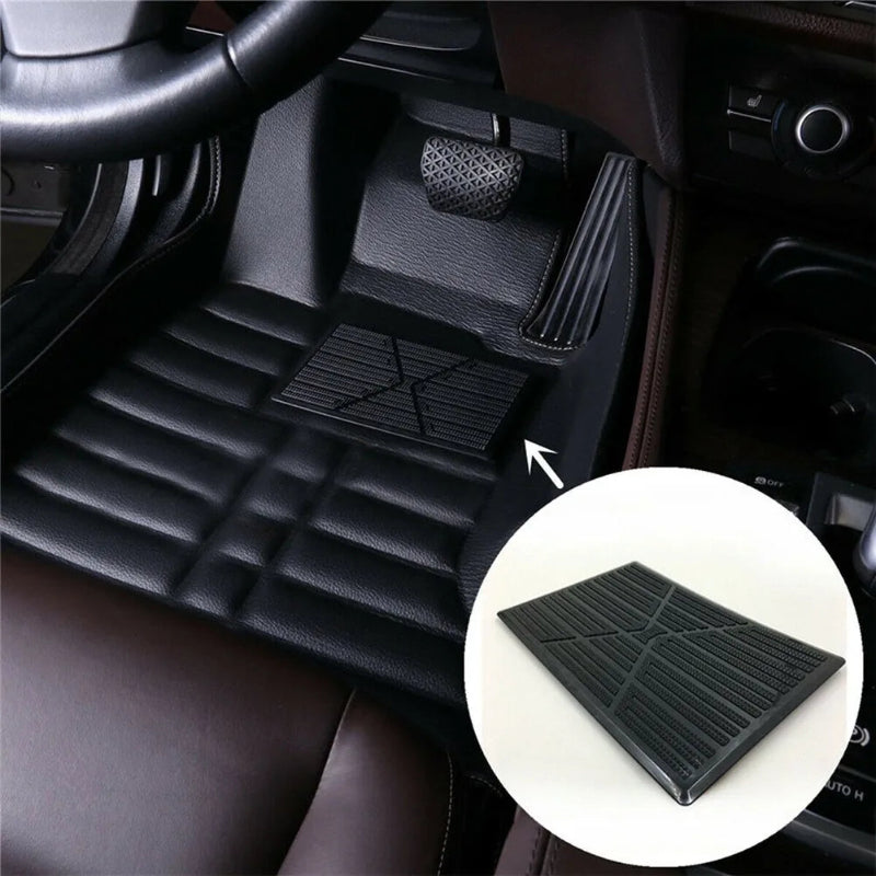 Car interior with black floor mats and a close-up of a mat detail.