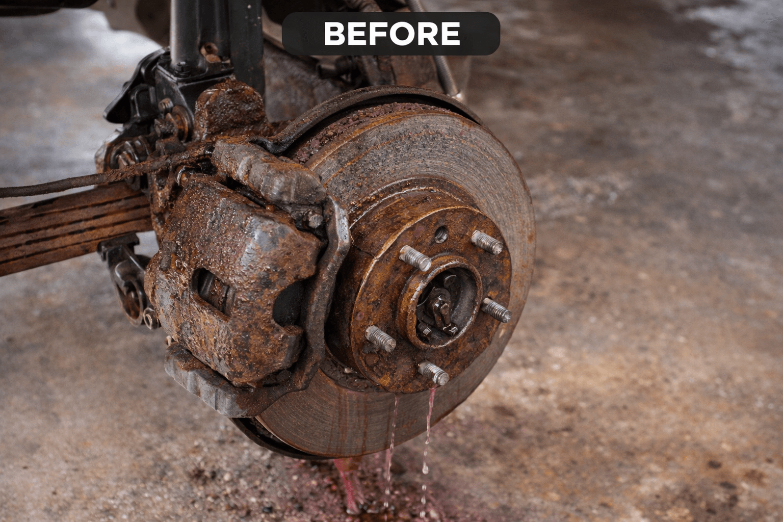 Heavily rusted brake disc, caliper and hub on a vehicle, labelled "before" treatment